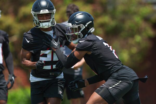 Falcons defensive back Jeff Okudah (1), right, and defensive back Micah Abernathy (29) participate in a drill during OTAs at the Atlanta Falcons Training Camp, Wednesday, May 24, 2023, in Flowery Branch, Ga. (Jason Getz / Jason.Getz@ajc.com)