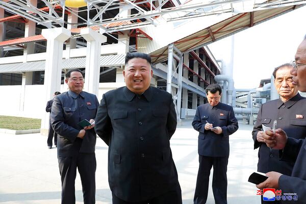 In this Friday, May 1, 2020, photo provided by the North Korean government, North Korean leader Kim Jong Un, center, visits a fertilizer factory in Sunchon, South Pyongan province, near Pyongyang, North Korea. Kim made his first public appearance in 20 days as he celebrated the completion of the fertilizer factory, state media said Saturday, May 2, 2020, ending an absence that had triggered global rumors that he may be seriously ill.  Independent journalists were not given access to cover the event depicted in this image distributed by the North Korean government. The content of this image is as provided and cannot be independently verified. Korean language watermark on image as provided by source reads: "KCNA" which is the abbreviation for Korean Central News Agency. (Korean Central News Agency/Korea News Service via AP)