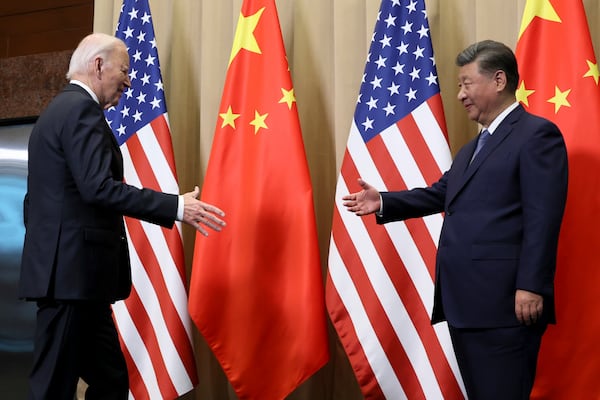 President Joe Biden approaches to shake hands with Chinese President Xi Jinping before a bilateral meeting, Saturday, Nov. 16, 2024, in Lima, Peru. (Leah Millis/Pool Photo via AP)