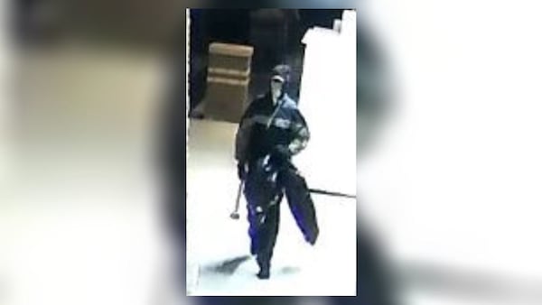 Surveillance footage appears to show a Gwinnett County burglary suspect carrying a sledgehammer.