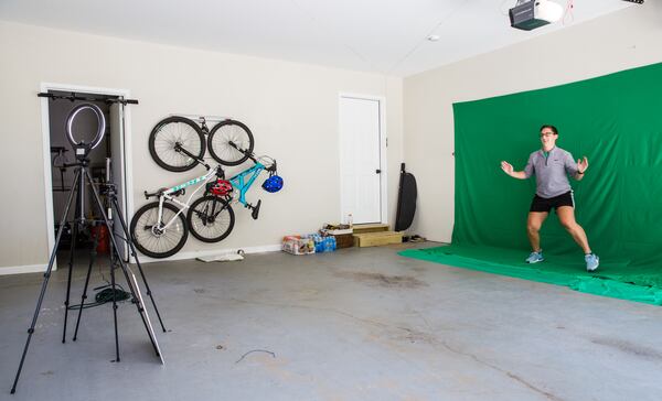 Springdale Park Elementary School teacher Jen Hagerty records physical education videos in her Marietta garage on Oct. 7, 2020.  Hagerty uses equipment provided to her by the school's parent-teacher organization.  (Jenni Girtman for the Atlanta Journal-Constitution)