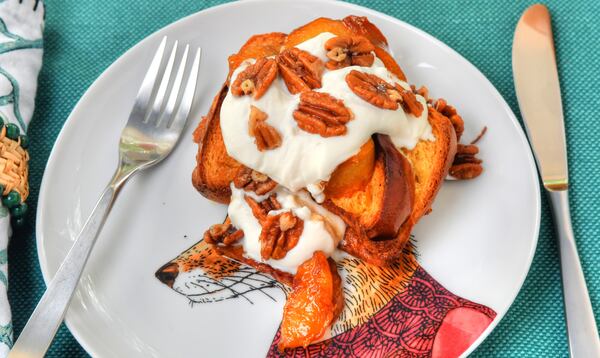 Baked French Toast With Skillet Fried Peaches, Butter Pecans and Whipped Cream is from a recipe from chef Jessica Rothacker, co-owner of Heirloom Cafe and Fresh Market in Athens. STYLING BY JESSICA AND JORDAN A. ROTHACKER / CONTRIBUTED BY CHRIS HUNT PHOTOGRAPHY