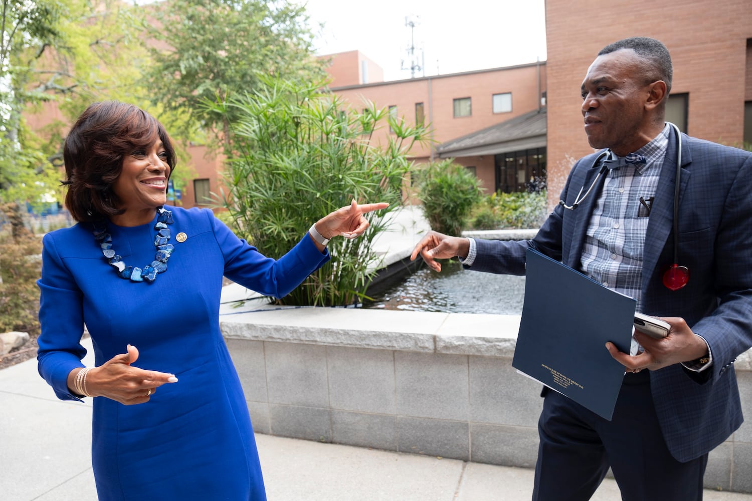 Dr. Montgomery Rice greets faculty member Dr. Rigobert Lapu after running into him on the Morehouse School of Medicine campus on the first day of class. (Ben Gray / Ben@BenGray.com)