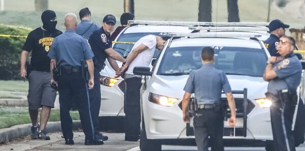 A woman was shot multiple times early Thursday, Oct. 12, 2017, after firing at a Gwinnett County SWAT officer, police said. The incident started when a SWAT team went to serve the woman drug-related warrants, Cpl. Michele Pihera said. The woman started shooting, and the officer returned fire, police said. JOHN SPINK/JSPINK@AJC.COM