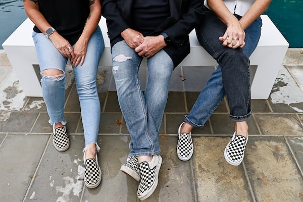 Mary Grace Henry (from left), Grant Henry and Merci Treaster even share the same taste in footwear. (Natrice Miller/natrice.miller@ajc.com)