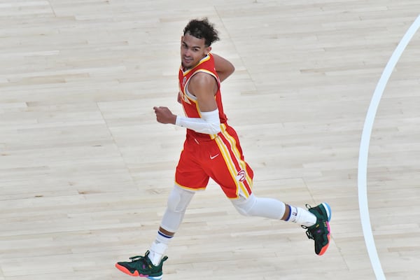 Hawks guard Trae Young (11) smiles after scoring during the second half. (Hyosub Shin / Hyosub.Shin@ajc.com)