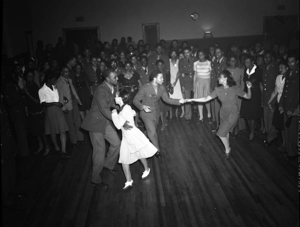 "High Hat" dance and party on Auburn Avenue in Atlanta, January 21, 1943. Photo shoot commissioned by fashion and home-goods mail-order merchandizer, Chicago Mail Order Company, owned by Alden's. LBCE4-025c, Lane Brothers Commercial Photographers Photographic Collection, 1920-1976. Photographic Collection, Special Collections and Archives, Georgia State University Library.