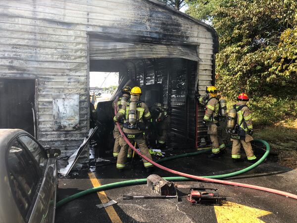 The owner of the emissions shop told firefighters he was testing a car when it caught fire.