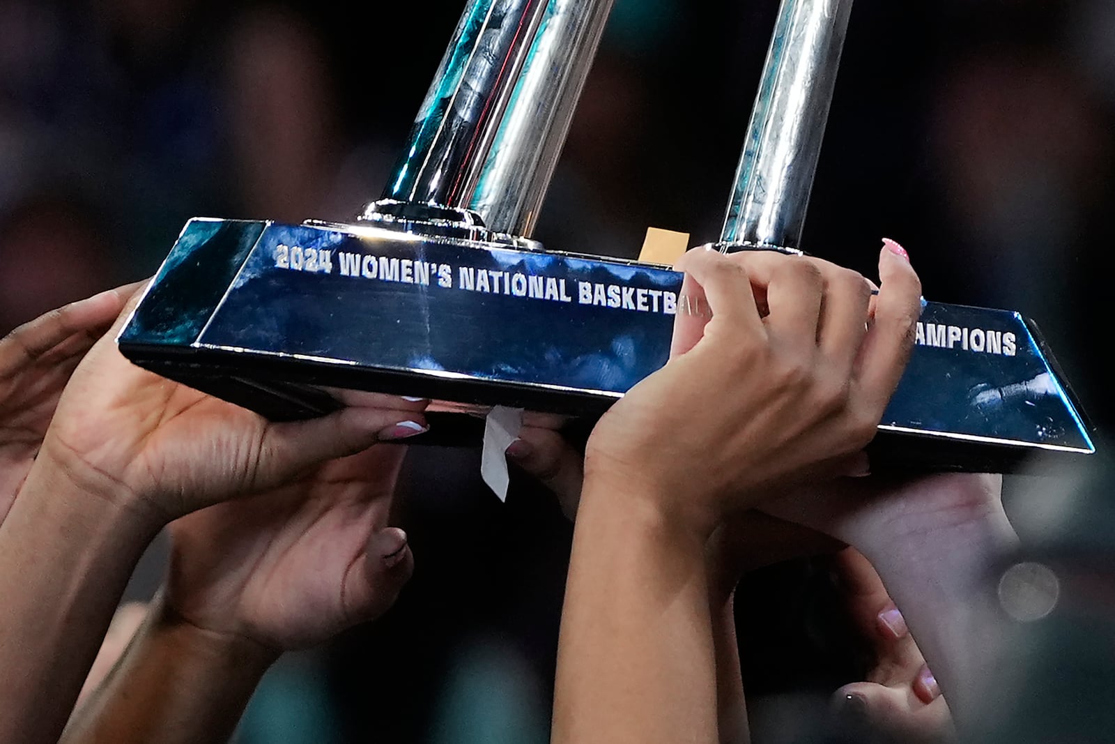 The New York Liberty hold up the championship trophy after defeating the Minnesota Lynx in Game 5 of the WNBA basketball final series, Sunday, Oct. 20, 2024, in New York. (AP Photo/Pamela Smith)