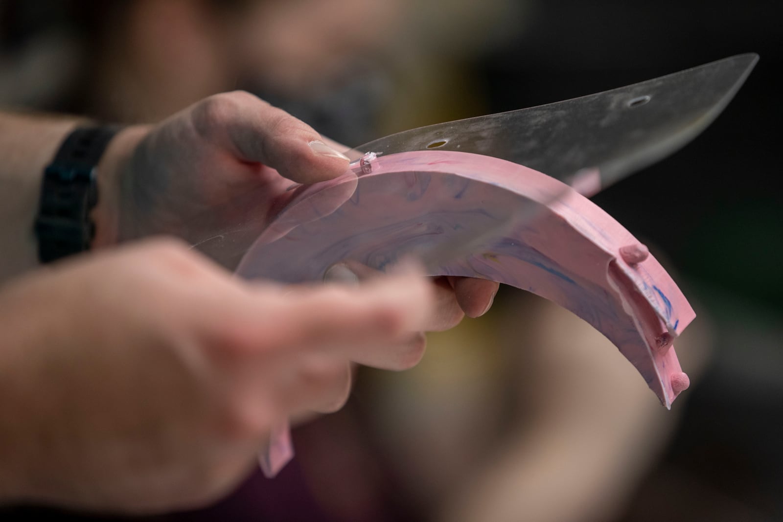 William Strika, executive director of Roswell Firelabs, pieces together a face shield at Roswell Firelabs in Roswell. (Alyssa Pointer / Alyssa.Pointer@ajc.com)