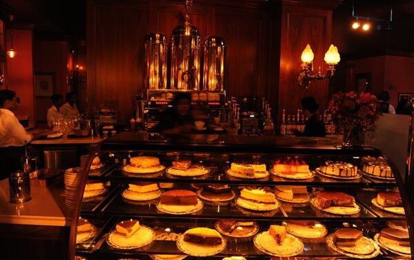 Cafe Intermezzo has glass display cases filled with decadent cakes.