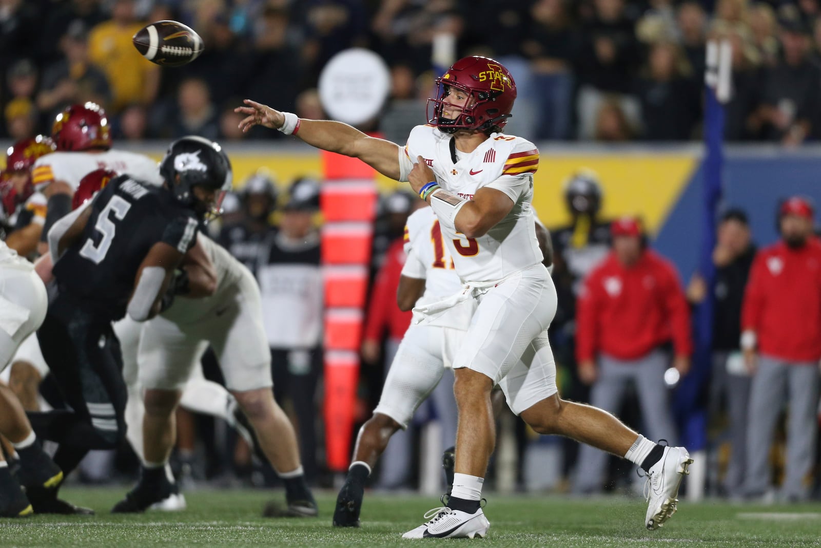 Iowa State quarterback Rocco Becht (3) makes a pass against the West Virginia during the first half of an NCAA college football game, Saturday, Oct. 12, 2024, in Morgantown, W.Va. (AP Photo/William Wotring)