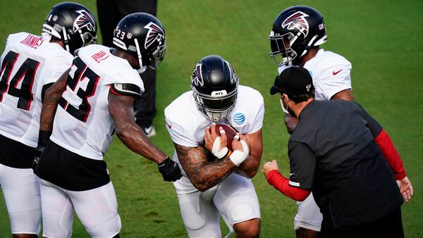 Falcons fullback Keith Smith runs drills during training camp practice at last summer Flowery Branch. (Brynn Anderson/AP)