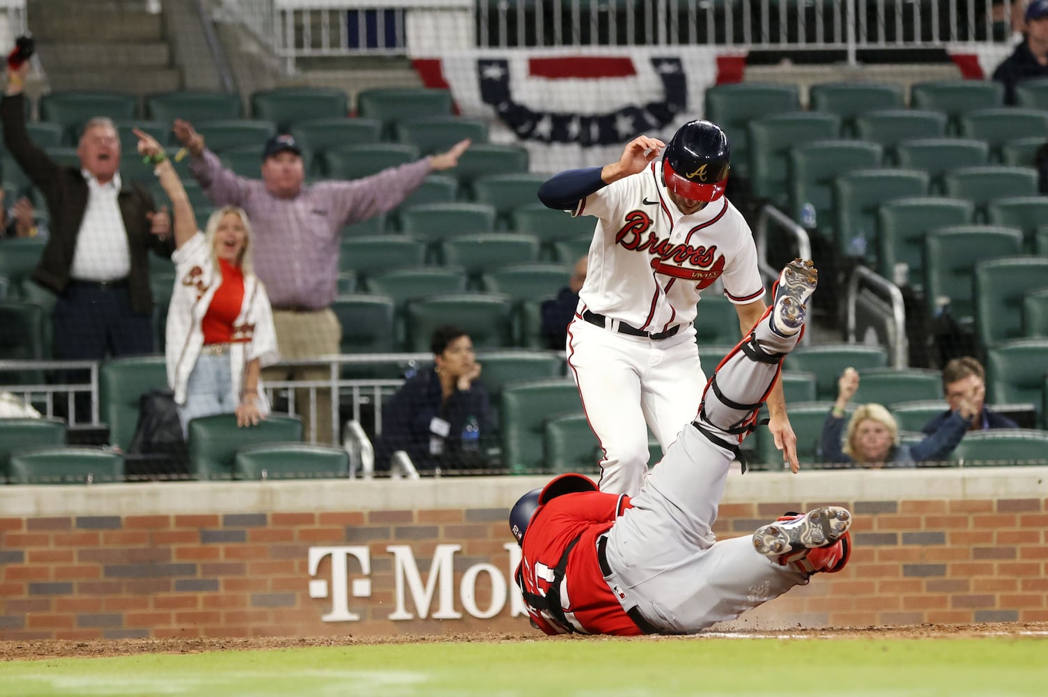 Braves first baseman Matt Olson scores Monday night at Truist Park. (Miguel Martinez/miguel.martinezjimenez@ajc.com)