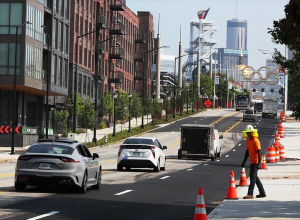 The cauldron from the 1996 Olympics is seen in the distance from an Atlanta street. 