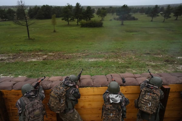 FILE - Ukrainian soldiers train at a military camp in eastern France, Wednesday, Oct. 9, 2024. (AP Photo/Thibault Camus, Pool, File)