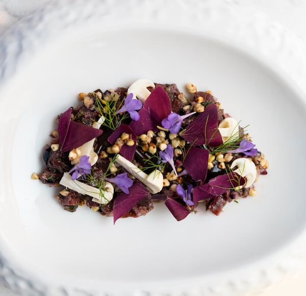 Venison tartare at Avize is a beautiful composition that has the minced game meat bound with a walnut ketchup and bulked up with buckwheat, fermented blueberries and beech mushrooms. Courtesy of Avize