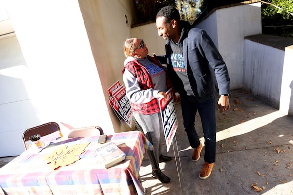 Dickens greets a campaign staffer at the end of a meet-and-greet in Ansley Park on Saturday. Miguel Martinez for The Atlanta Journal-Constitution 