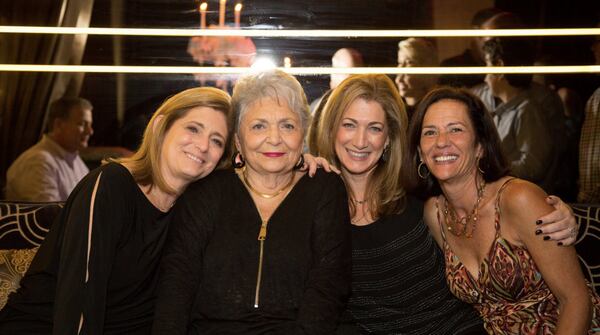 Daughters Mitzi Waronker (left) and Jody Feldman (third from left) worry about their mother Mary Lou Lazarus (second from left), who is living alone in Atlanta during the coronavirus pandemic. CONTRIBUTED