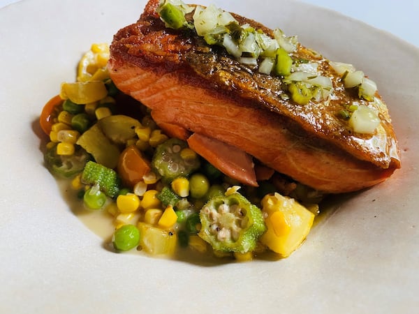 Leon’s steelhead trout plate features local summer squash, peas, heirloom tomatoes, corn, okra and jalapeño chimichurri. CONTRIBUTED BY BOB TOWNSEND