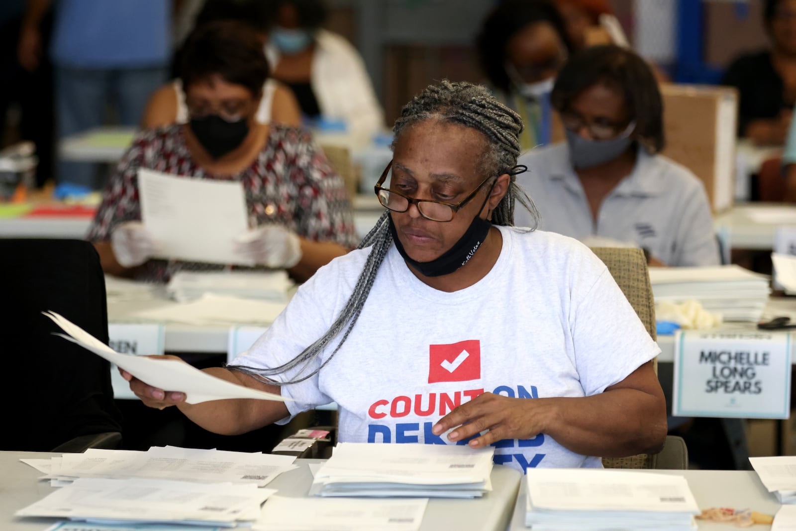 053022 Decatur: Poll workers hand count advanced ballots at the DeKalb Voter Registration and Elections Office, Monday, May 30, 2022, in Decatur, Ga. (Jason Getz / Jason.Getz@ajc.com)