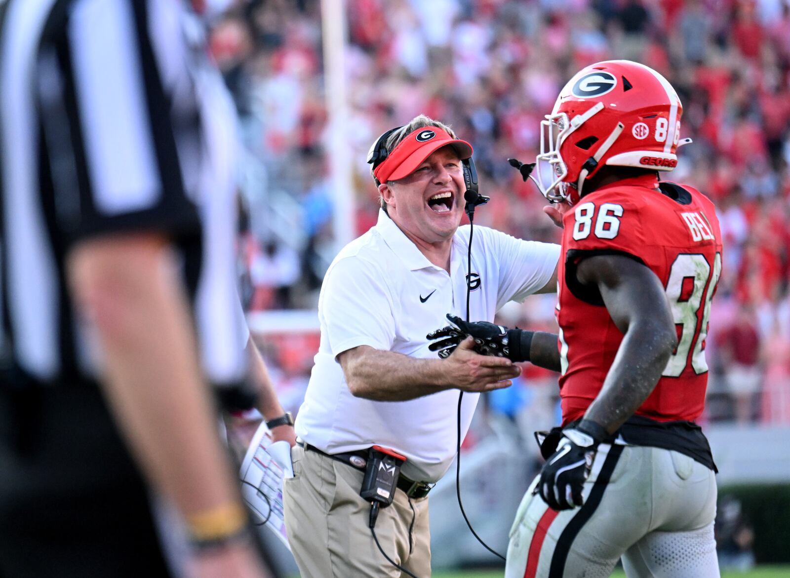 Georgia wide receiver Dillon Bell (86) is celebrated by Georgia head coach Kirby Smart after scoring a touchdown during the second half in an NCAA football game at Sanford Stadium, Saturday, October 5, 2024, in Athens. Georgia won 31-13 over Auburn. (Hyosub Shin / AJC)