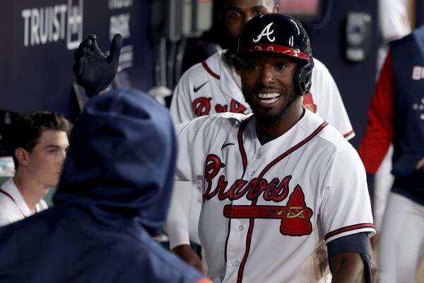 Braves right fielder Travis Demeritte celebrates his solo home run with teammates during the fifth inning against the Chicago Cubs at Truist Park Tuesday, April 26, 2022, in Atlanta. (Jason Getz / Jason.Getz@ajc.com)