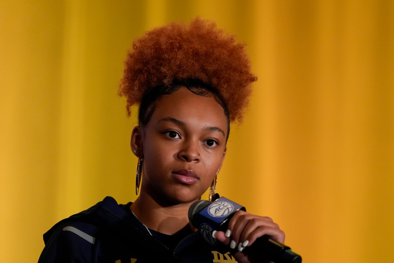 Notre Dame guard Hannah Hidalgo speaks during a ACC women's NCAA college basketball media day, Tuesday, Oct. 8, 2024, in Charlotte, N.C. (AP Photo/Chris Carlson)