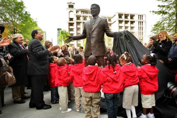 Charlie Loudermilk (left) applauds at the unveiling of the statue of Andrew Young in downtown Atlanta. The unlikely duo - Loudermilk was  conservative Republican and Young a Democratic civil rights activist and politician - were close friends and allies. Loudermilk brought business support behind Young's campaigns and also paid for the statue.