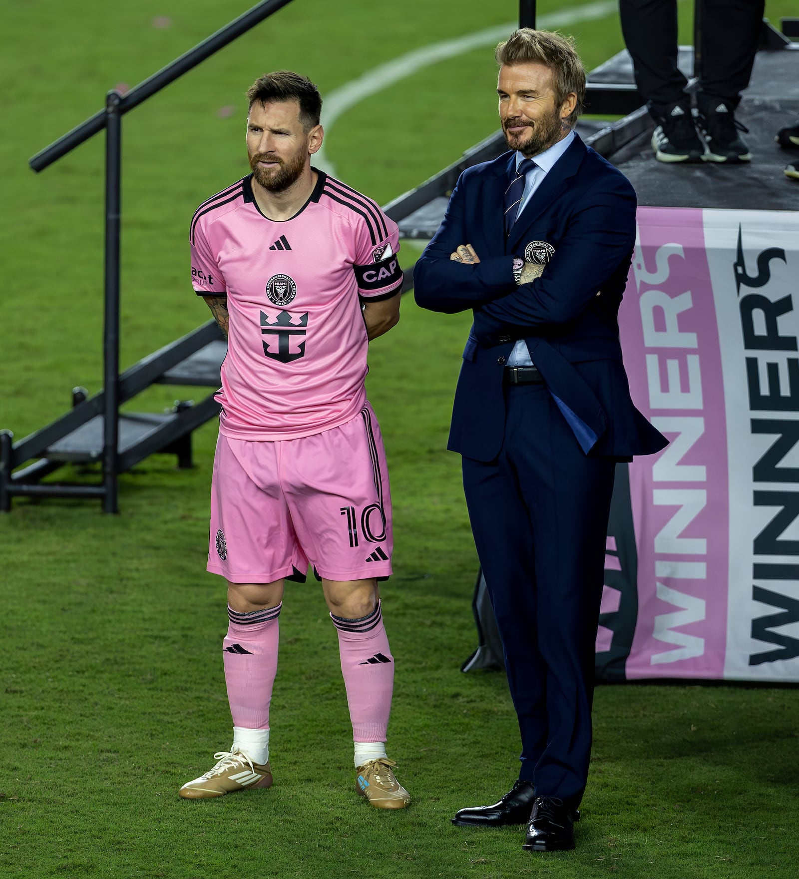 Inter Miami forward Lionel Messi, left, and Inter Miami co-owner David Beckham talks before the ceremony of the Supporters' Shield after their match against the New England Revolution at Chase Stadium in Fort Lauderdale, Fla., Saturday, Oct. 19, 2024. (David Santiago/Miami Herald via AP)