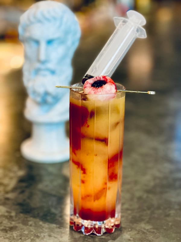 The nonalcoholic Vampire's Kiss at the Office Bar in Epicurean Atlanta is a mix of tropical flavor with a spooky garnish.
(Courtesy of The Office Bar)