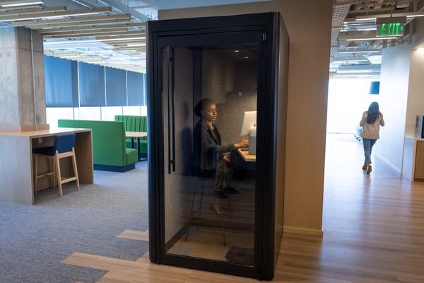 An employee works at Cisco’s new office space at Coda in Atlanta on Tuesday, April 11, 2023. (Arvin Temkar / arvin.temkar@ajc.com)