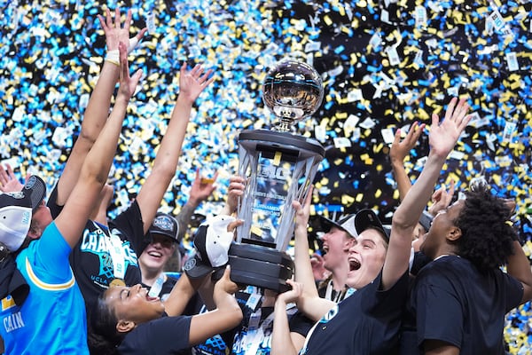 UCLA players celebrate after an NCAA college basketball game against Southern California in the championship of the Big Ten Conference tournament in Indianapolis, Sunday, March 9, 2025. (AP Photo/Michael Conroy)