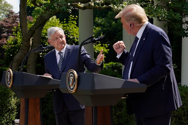 FILE - Mexico's President Andres Manuel Lopez Obrador, left, and President Donald Trump hold a joint news conference at the White House in Washington, July 8, 2020. (AP Photo/Evan Vucci, File)