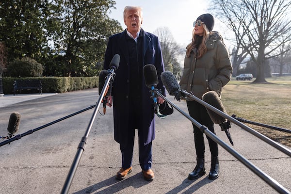 First lady Melania Trump looks on as President Donald Trump speaks with reporters before boarding Marine One on the South Lawn of the White House, Friday, Jan. 24, 2025, in Washington. (AP Photo/Evan Vucci)