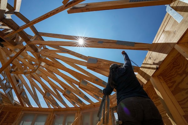 File - Workers build a home on Sept. 19, 2023, in Marshall, N.C. (AP Photo/Chris Carlson, File)