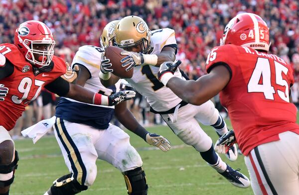 November 26, 2016 Athens - Georgia Tech running back Qua Searcy (1) leaps over for a game winning touchdown in the second half at Sanford Stadium on Saturday, November 26, 2016. Georgia Tech won 28-27 over the Georgia. HYOSUB SHIN / HSHIN@AJC.COM