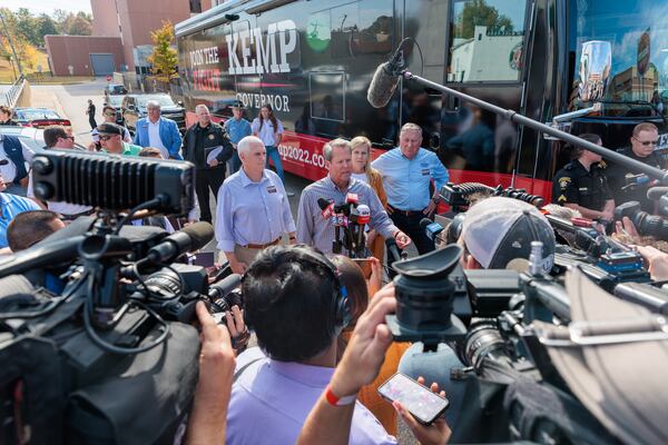 Gov. Brian Kemp speaks to reporters after a rally featuring former Vice President Mike Pence in Cumming on Tuesday, November 1, 2022. (Arvin Temkar / arvin.temkar@ajc.com)