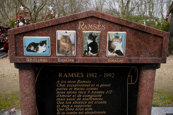 A grave for a cat named "Ramses" is seen at the pet cemetery of Asnieres-sur-Seine, west of Paris, Friday, Feb. 21, 2025. (AP Photo/Michel Euler)