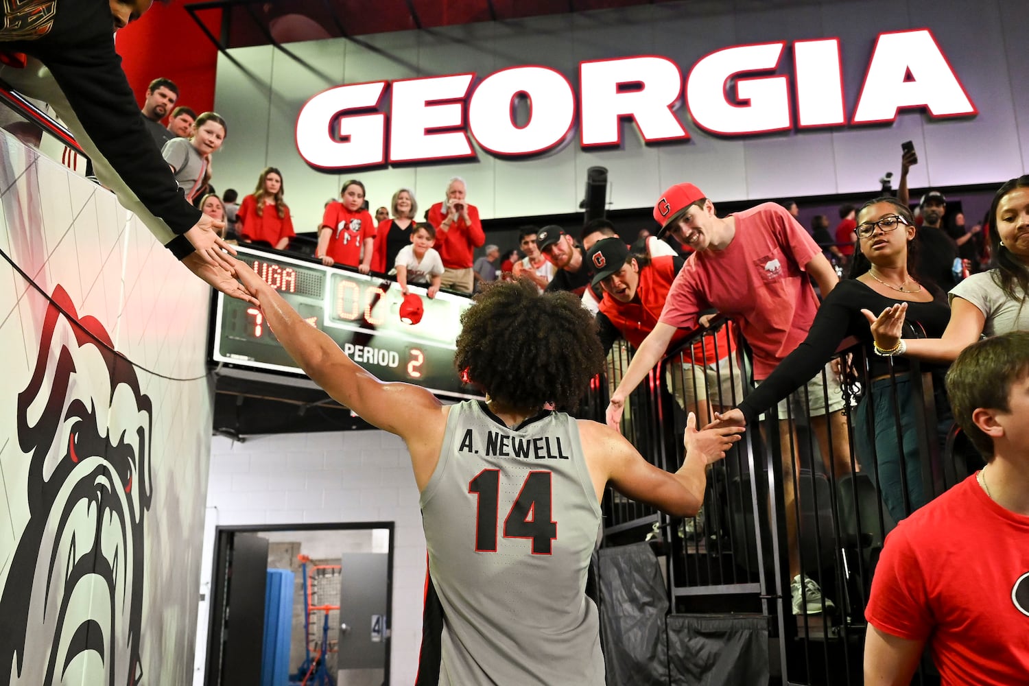 Georgia forward Asa Newell (14) celebrates the Dawgs 79-68 win. (Daniel Varnado/For the Atlanta Journal-Constitution)