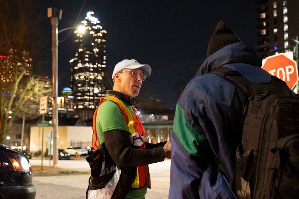 Erik Johnson interviews a man during a “point-in-time” count of people experiencing homelessness in Atlanta on Monday, Jan. 22, 2024.   (Ben Gray / Ben@BenGray.com)