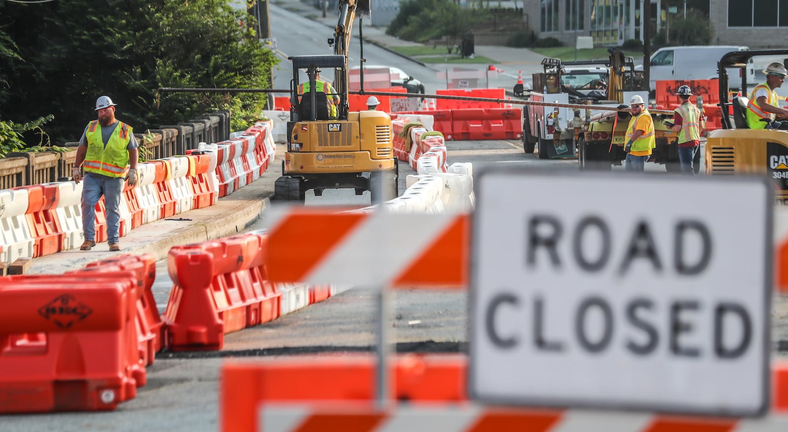 Workers repair a bridge on Cheshire Bridge Road after a fire Aug. 4.
