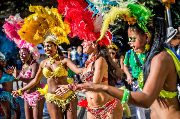 PARADING AROUND LITTLE 5--October 17, 2015 Atlanta - Lilian Reis (right), Andrea Moreira, Dirlene Carr and Carla Stafford dance as they wait for the start of the Little Five Points Halloween Parade in Atlanta on Saturday, October 17, 2015. The annual parade brought out tens of thousands of people to watch the antics. JONATHAN PHILLIPS / SPECIAL