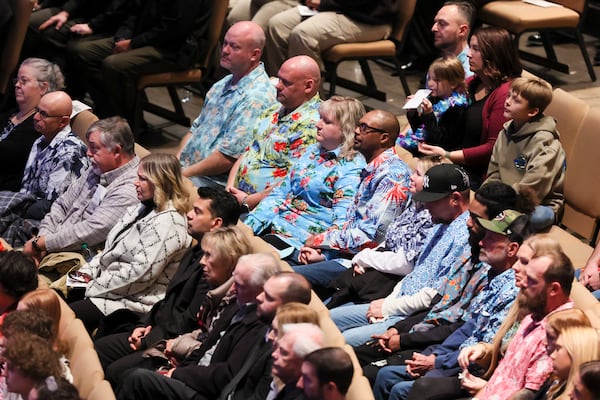 Sgt. Marc McIntyre's friends wore Hawaiian shirts in his honor during the memorial service for him Friday. (Jason Getz / Jason.Getz@ajc.com)