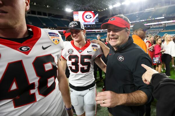 Georgia head coach Kirby Smart greets players after Georgia’s 63-3 win against Florida State in the Orange Bowl at Hard Rock Stadium, Saturday, Dec. 30, 2023, in Miami Gardens, Florida. The Bulldogs are 3-1 to win the 2024 national championship. And with Jim Harbaugh's return to the NFL, the Bulldogs probably won’t have to worry much about Michigan being in the way. (Jason Getz / Jason.Getz@ajc.com)