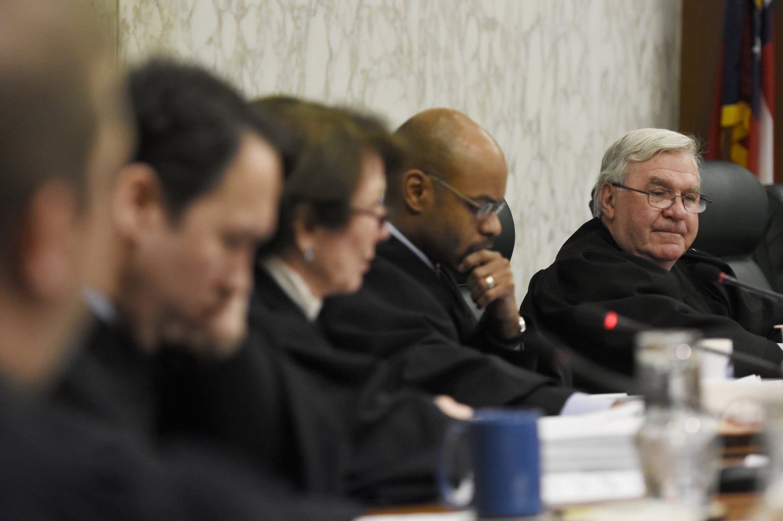 Chief Justice P. Harris Hines and other justices listen during oral arguments in Atlanta, on Monday. The Georgia Supreme Court is meeting for the first time this year with a new chief justice and two additional justices. (David Barnes / dbarnes@ajc.com)