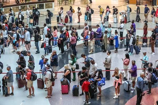 Passengers lined up for screening at the main security checkpoint at Hartsfield-Jackson International Airport on Friday, June 28, 2024. Credit: John Spink / jspink@ajc.com