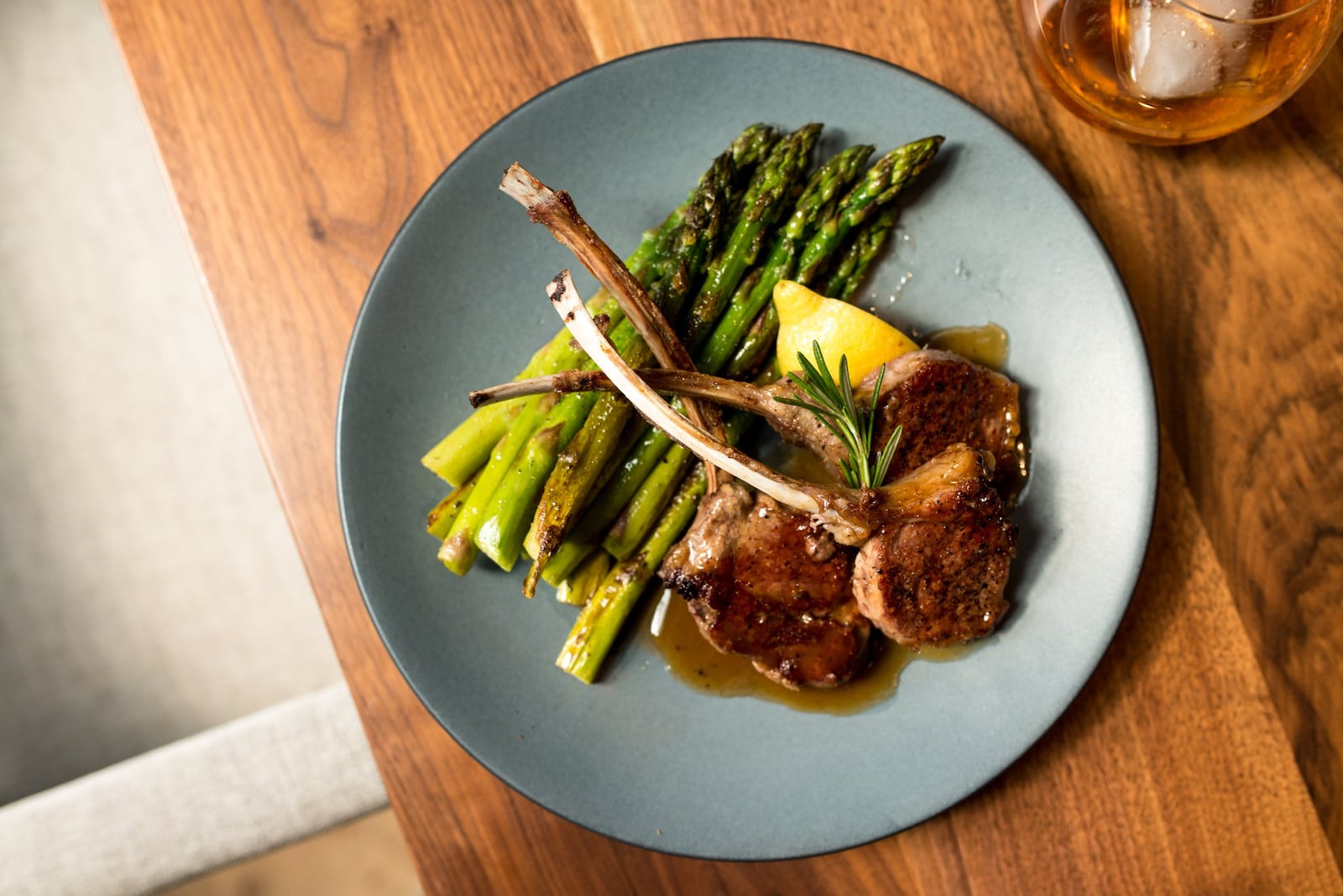 New Zealand lamb chops served with bourbon and rosemary gastrique, and sauteed asparagus. Photo credit- Mia Yakel.