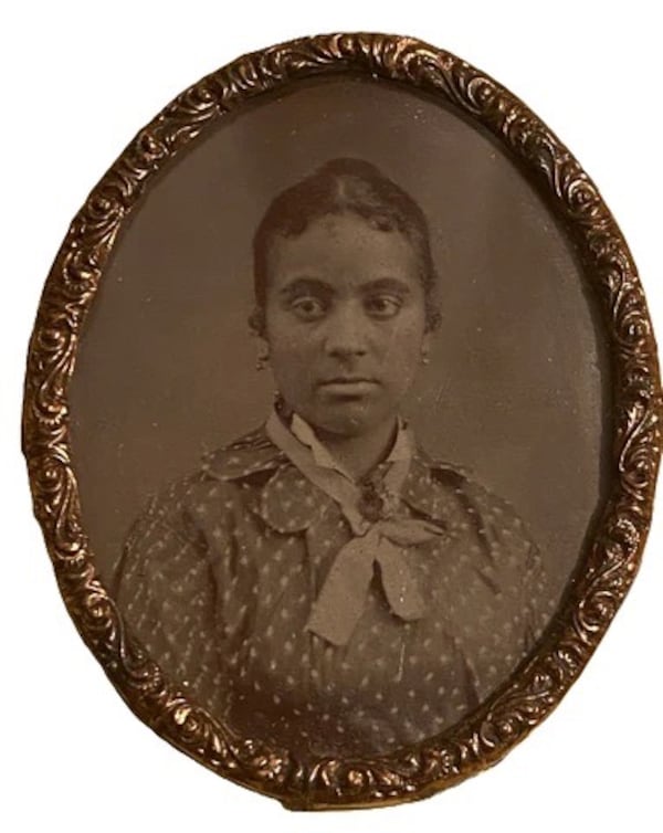 Antique Victorian era tintype of an unidentified Black woman in patterned dress, 1870s, part of the "Ancestral Garden" exhibit at APEX Museum through Jan. 25.