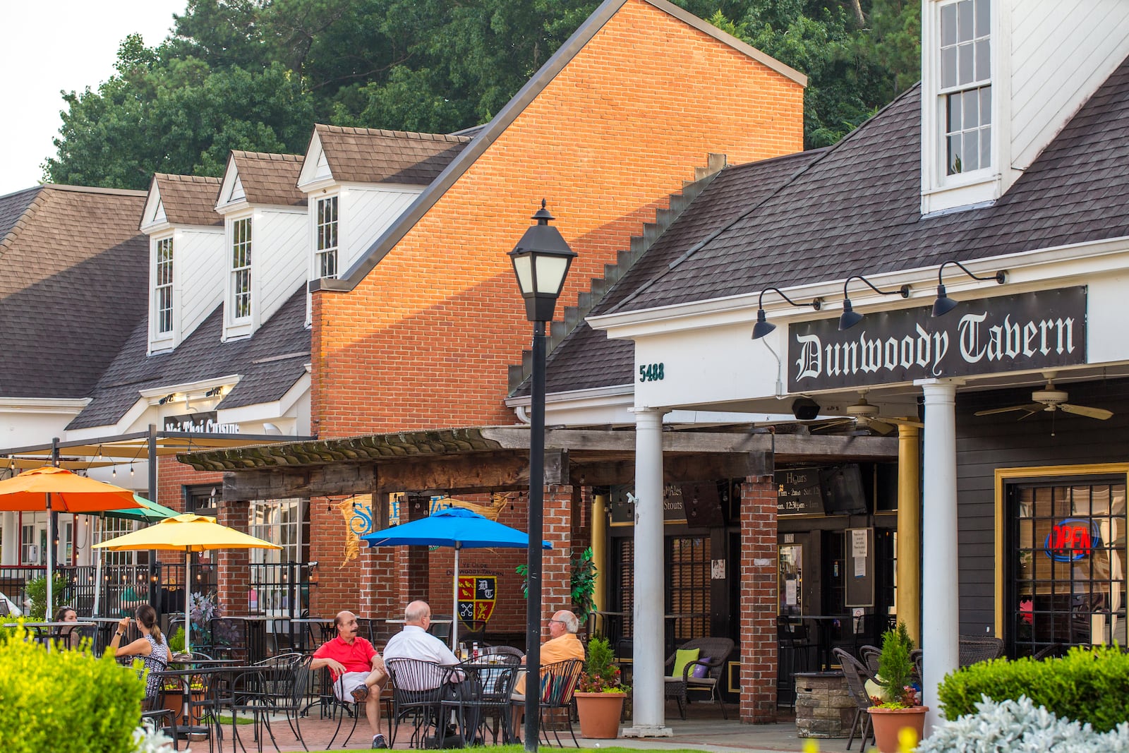 Dunwoody Village businesses, including those in The Shops of Dunwoody strip mall, may soon have a new city center, in the mean time the locals enjoy whatever green space and outdoor patios they can find in the multiple shopping complexes, patched together in the area on Thursday, July 22, 2021.  (Jenni Girtman for The Atlanta Journal-Constitution)